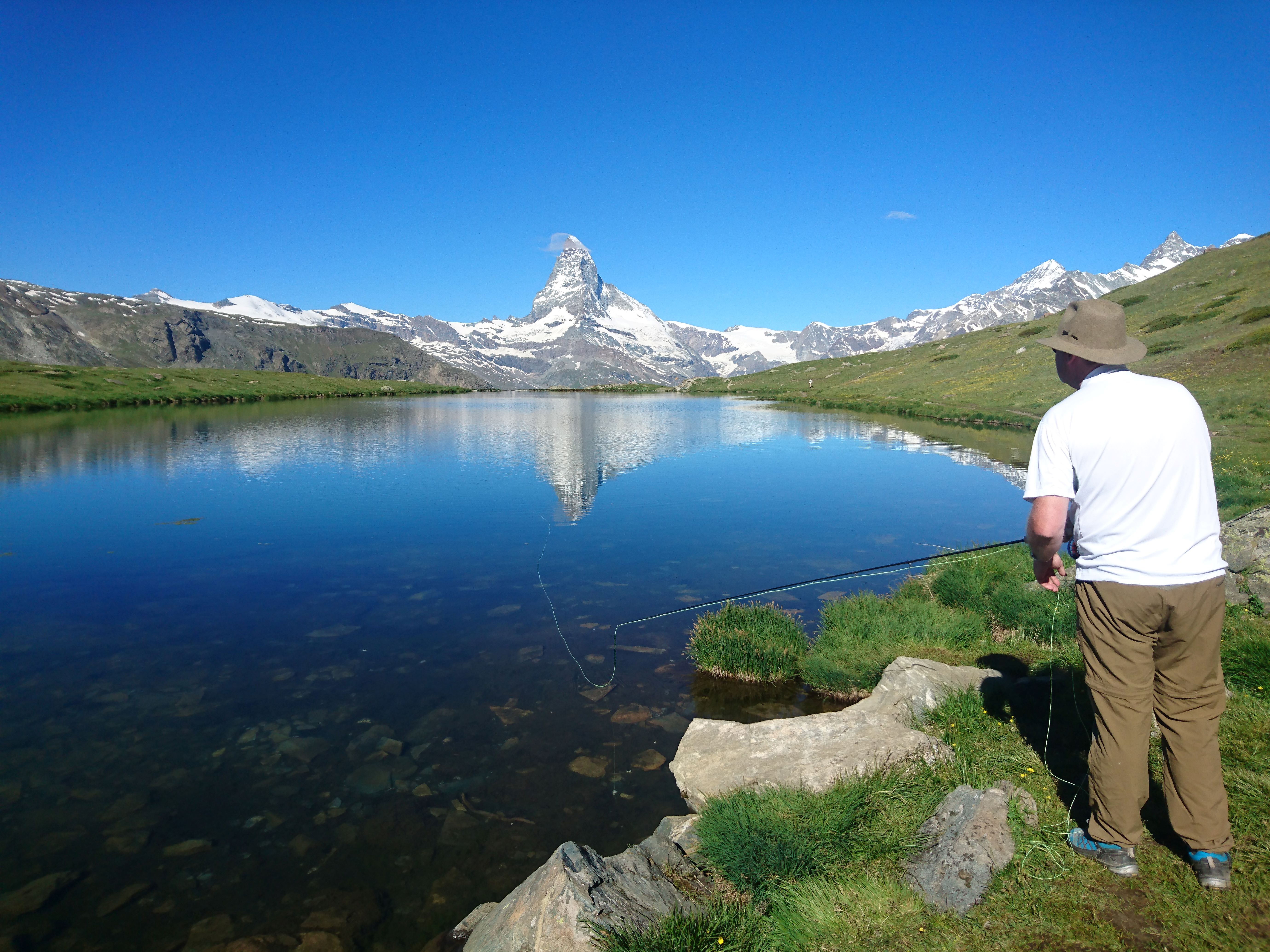 Fly Fishing in Switzerland, casting to the tip of the Matterhoen