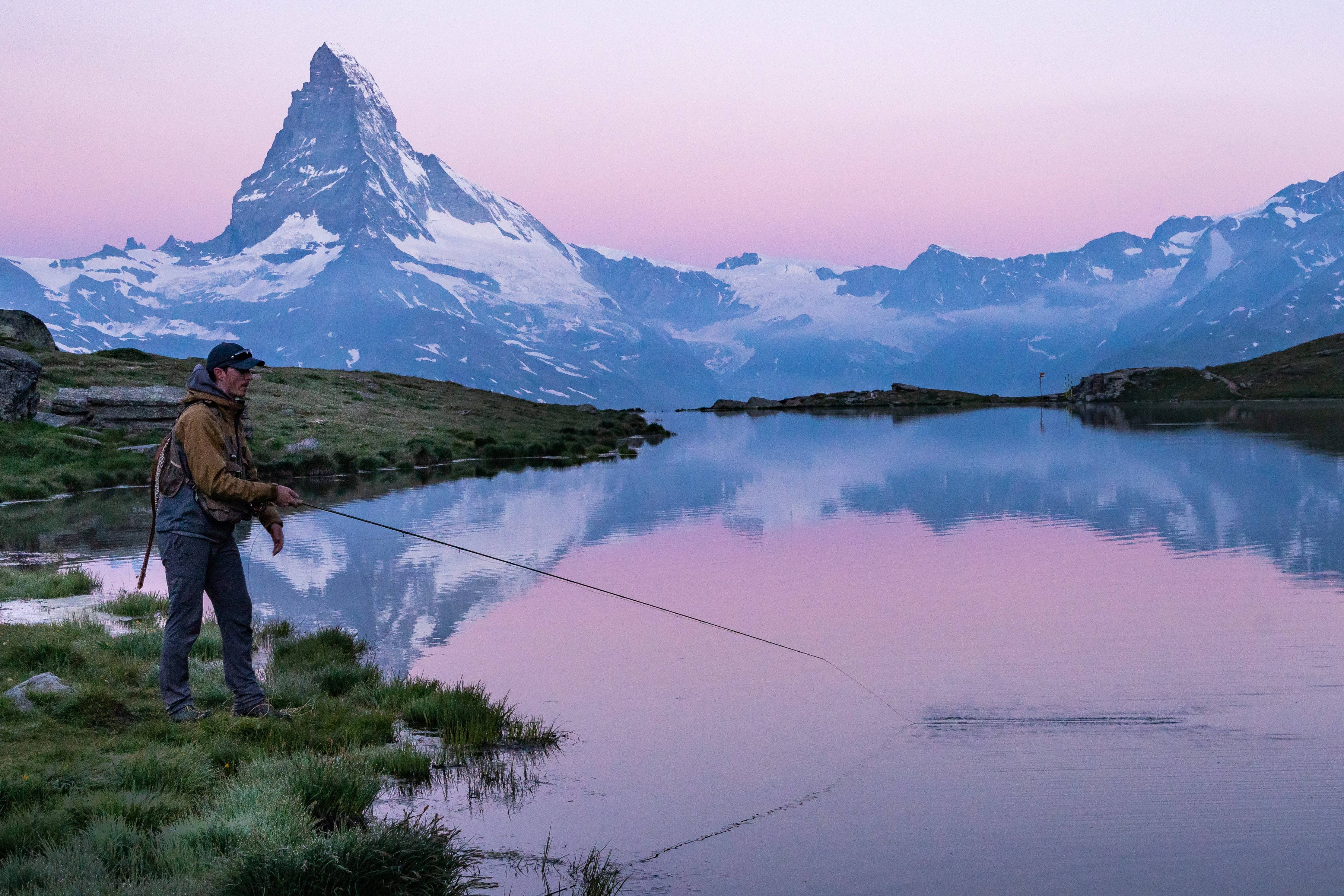 Fly Fishing in Switzerland, with a purple Matterhorn sunset 
