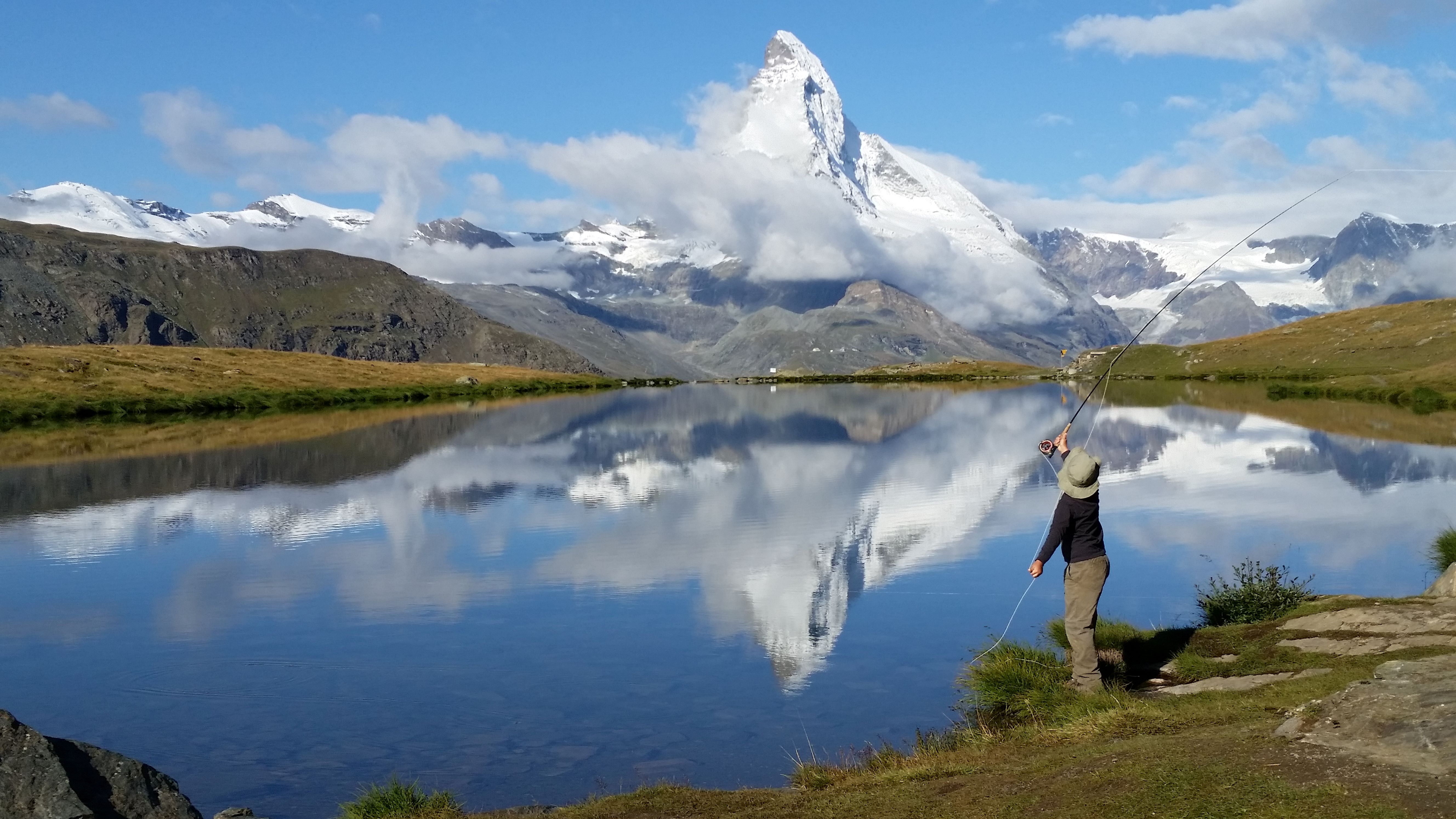 Fly Fishing in Switzerland, casting into the Matterhorn refection
